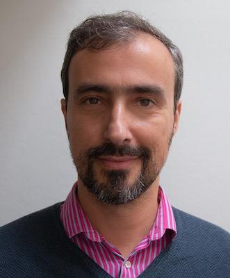 Pedro smiling during a leadership coaching session